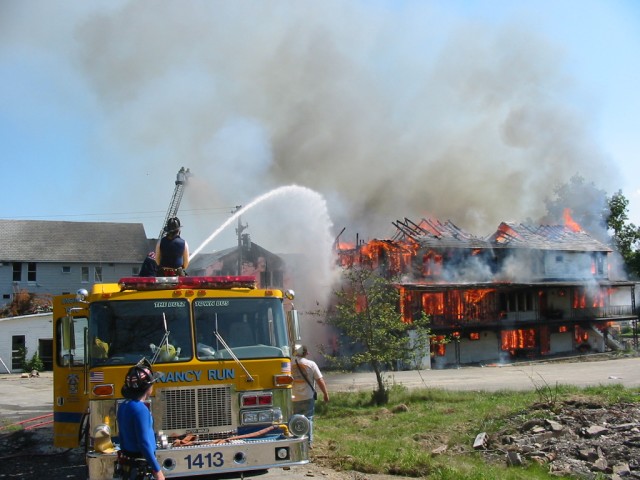 E-1413 controlling embers at a training burn.